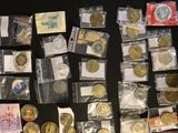 a lot of coins that are sitting on a table