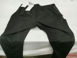 a pair of pants sitting on a bed in a room
