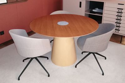 two chairs around a round table in a room