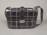 an image of a black purse on a white background