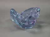 a glass sculpture that is sitting on a table