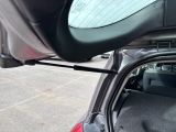 a car with its trunk open in a parking lot