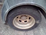 a close up of a flat tire on a truck