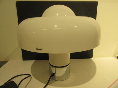 a lamp that is sitting on a table next to a mouse