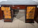 an image of a desk with drawers and a marble top