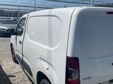 a white van that is parked in a parking lot