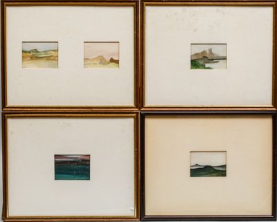 four framed photographs of watercolors of a beach and a body of water