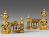 pair of gilded bronze candlesticks with figures on a bridge