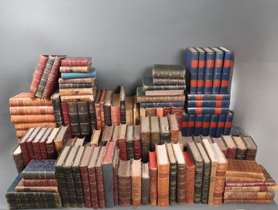 a lot of old books stacked on top of each other