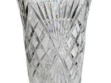 a glass vase that is sitting on a white surface