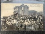 an old photo of a crowd of people standing in front of a building