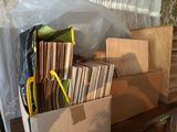 a box full of vinyl records and a pair of scissors