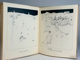 an open book with a drawing of a man on a snowboard