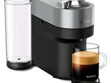 an image of a coffee maker with a glass of water next to it