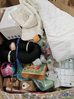 a cardboard box filled with a pile of items