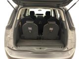 four seats in the back of a car with the trunk open