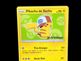 yellow pokemon card with pikachu de sacha on it