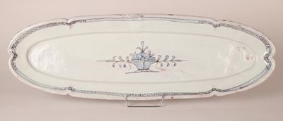a white platter with a blue and white design on it