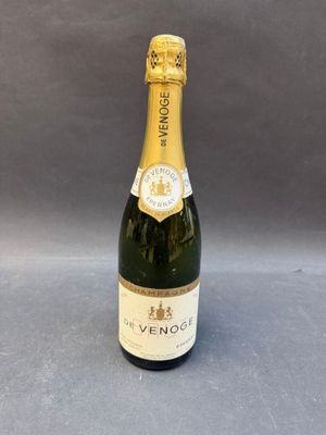 a close up of a bottle of champagne on a table