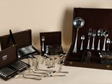 a box with silverware and a case with spoons and spoons