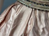 a close up of a woman ' s dress with sequins on it