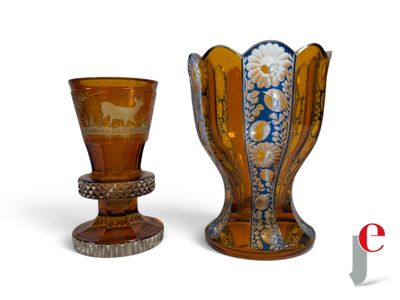 two vases sitting next to each other on a white surface