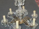 a crystal chandelier with five candles on it
