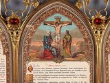 a gold frame with a picture of jesus on the cross on it