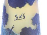 a vase with a blue and yellow design on it