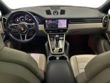 the interior of a car with a steering wheel, dashboard, and dashboard controls