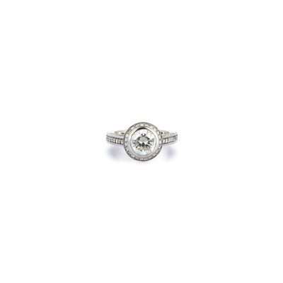 a close up of a diamond ring on a white background