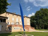 a blue flag that is in front of a building