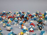 many small figurines of different sizes and colors