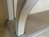a close up of a corner of a room with a marble floor