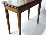 a small wooden table with a marble top on a white background