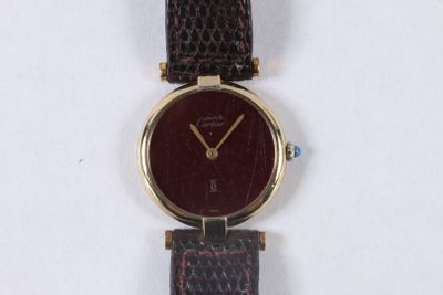 an image of a close up of a wrist watch on a white surface