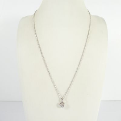 a close up of a necklace on a mannequin mannequin