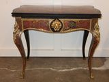 a small table that has a clock on top of it