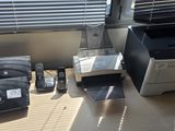 a desk with a printer and other office supplies on it