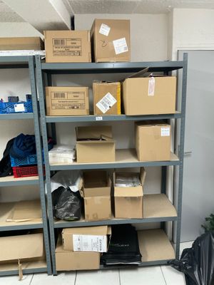 many boxes on the shelves in the room