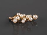 a close up of a pair of pearls on a black surface
