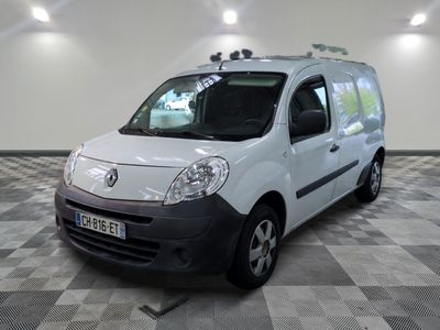 a white van that is parked on a checkered floor