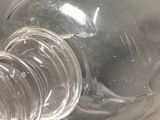 a plastic bottle with a plastic stopper on it