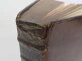 an old book that is sitting on top of a table