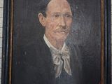 painting of a man in a suit and bow tie in a black frame