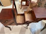 a small wooden table with a drawer on top of it