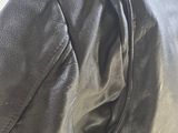 a close up of a black leather jacket on a mannequin mannequin mannequin mannequin mannequin mannequin manne