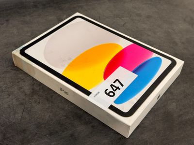 an open box with a colorful screen on it sitting on a table