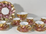 an image of a group of coffee cups and saucers on a table