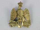 une image représentant un aigle doré coiffé d'une couronne